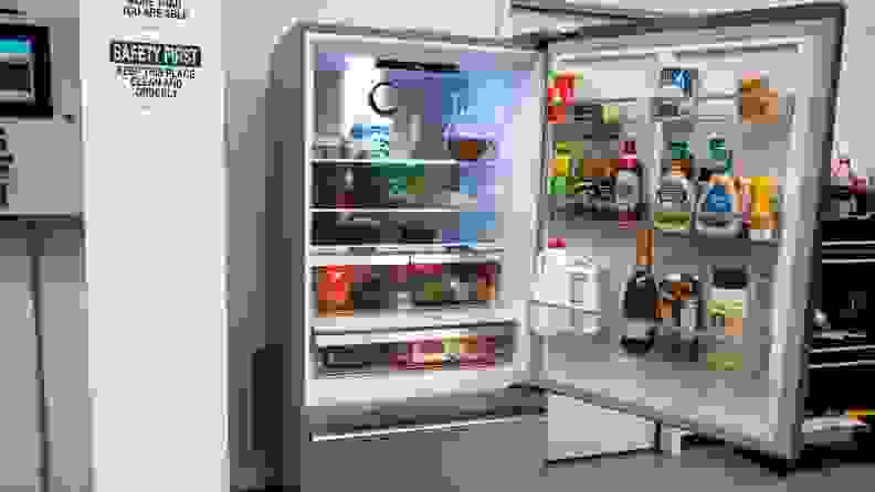 Assorted chilled foods stored inside of the Beko BFBD30216SSIM Bottom-freezer Refrigerator on shelves and inside of door storage.