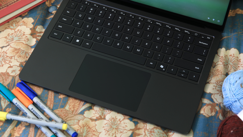 An overhead view of an opened Microsoft Surface Laptop 7th Edition showing its keyboard.