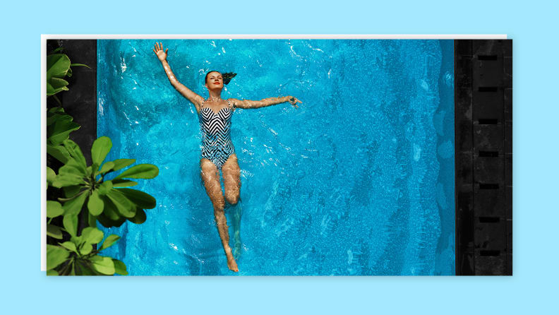 Person floating in swimming pool.