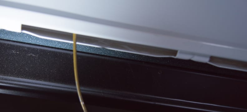 Thread the wire through the slot