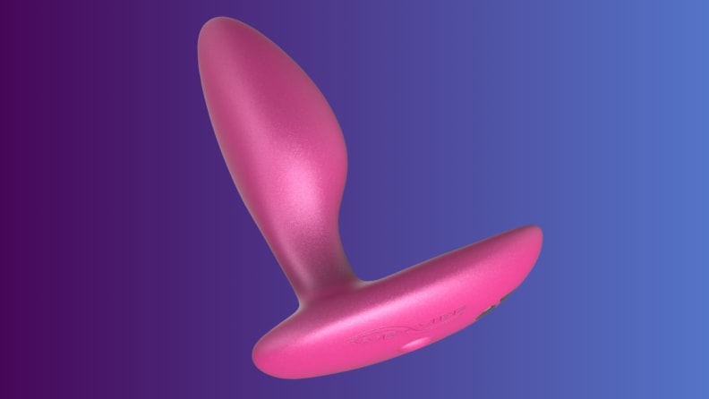 An anal sex toy sits on an indigo fade background