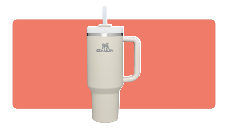 A 40-ounce Stanley tumbler cup in cream color.