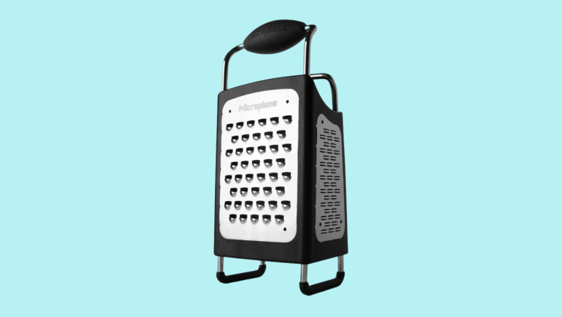 Box cheese grater against cyan background