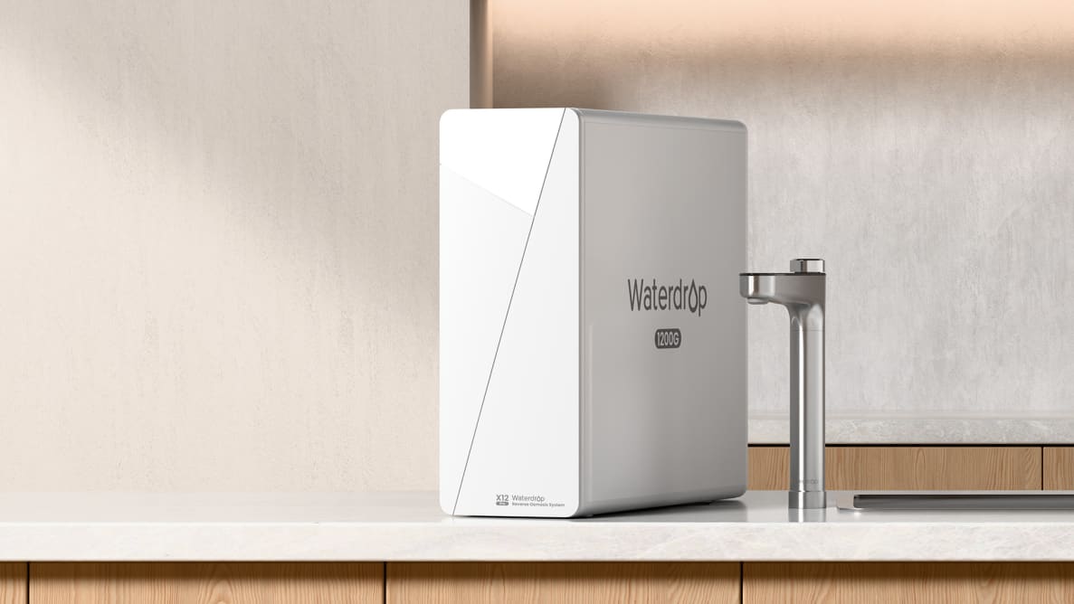 A Waterdrop RO system sits next to the smart faucet on the counter