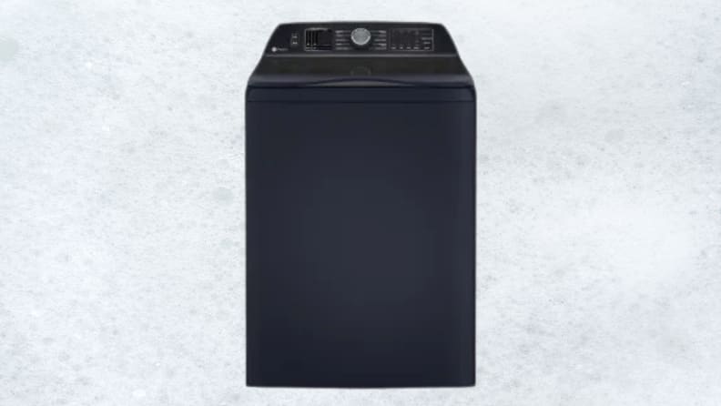 A dark blue washing machine sits on a white sudsy background