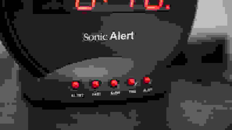 a close up of the buttons on the bottom of the sonic bomb alarm