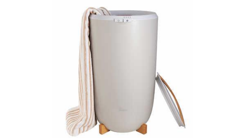 A towel warmer with a towel hanging off of it