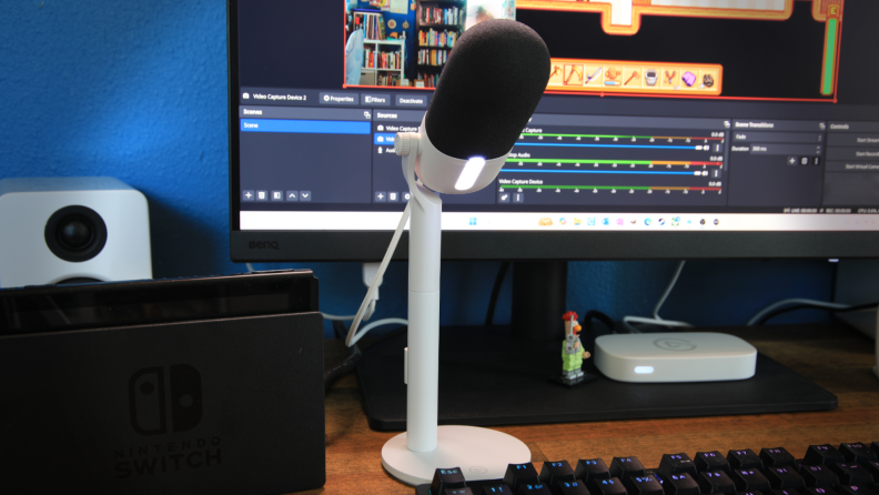 The Elgato Wave Neo microphone, a simple white plastic USB mic with a black boom.