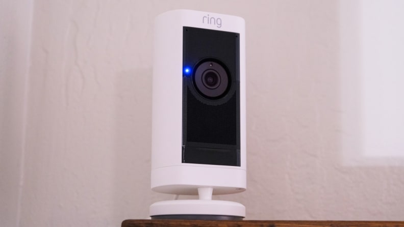 The Ring Stick Up Cam Pro battery shown sitting on a wood shelf