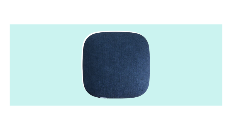 A dark blue, rectangular Quiet Mind Pillow with rounded edges.