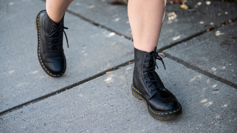 Girl walking in Doc Martens boots.