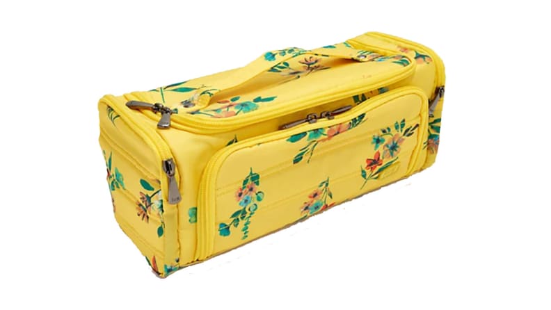 yellow colored luggage travel bag on white background