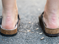 Girl wearing a pair of Birkenstock Boston clogs.