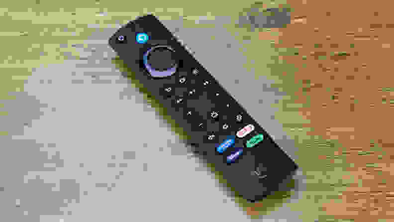 The included remote for the Amazon Fire TV Cube sitting on a wooden table.