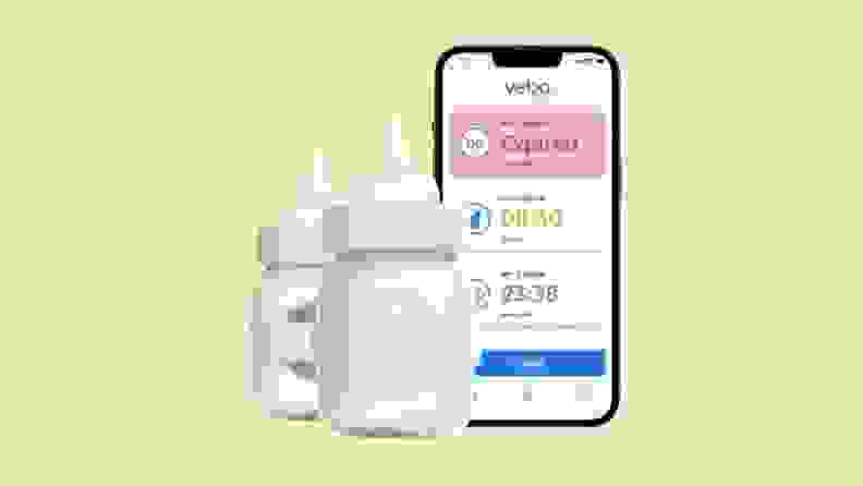 The Veba smart bottle pictured next to a smart phone running the companion app.