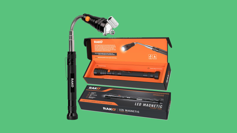 Magnetic flashlight with case on green background