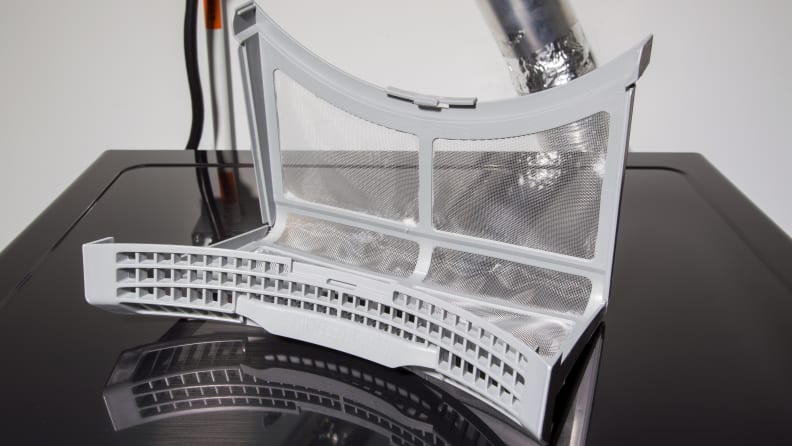 The dryer's lint trap is difficult to open