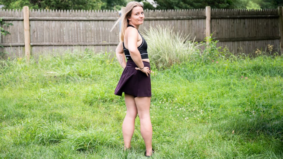 Girl in yard wears Spanx Get Moving Skort.