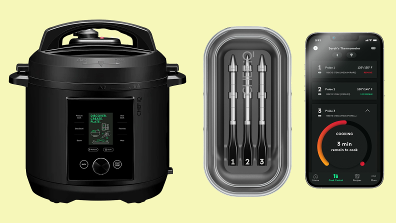 Product shot of the Chef IQ Smart Cooker next to three Chef IQ Smart Themometers in their carrying case next to a smart phone.