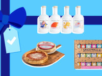 White bottles, a pizza pack and a spice box on a blue gift background