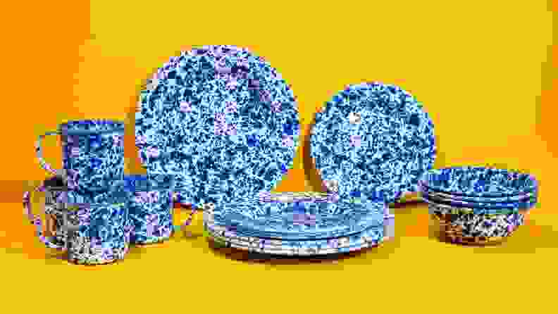Blue speckled dinnerware set with a bright yellow background.