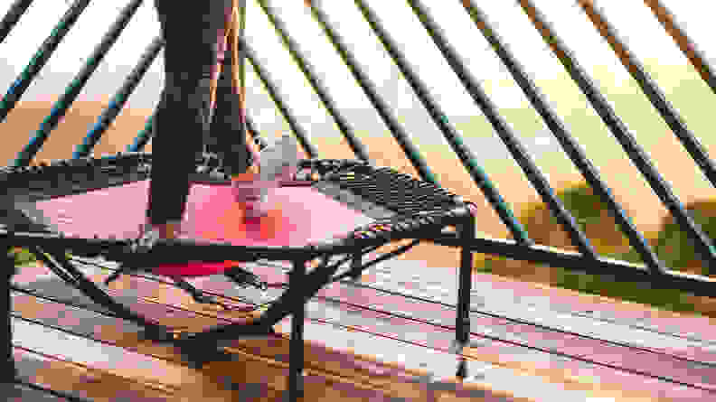 A close-up image of a person's feet while they use a mini rebounder.