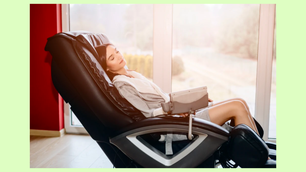 A person relaxes in a luxurious massage chair.