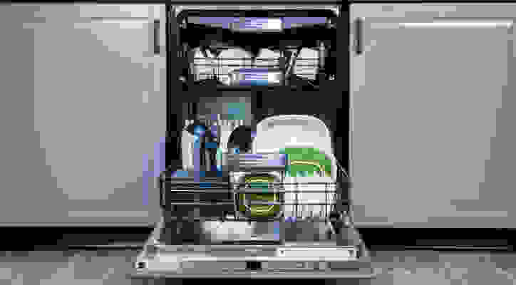 Loaded open dishwasher