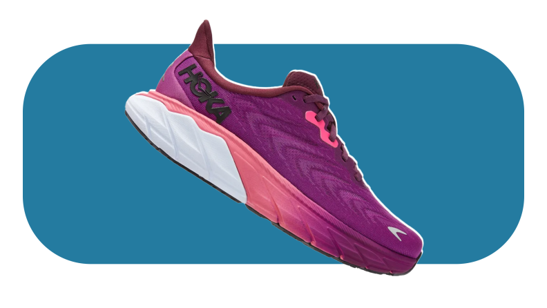 The Hoka Challenger 7 shoe in the color purple, white, and pink on a blue background.