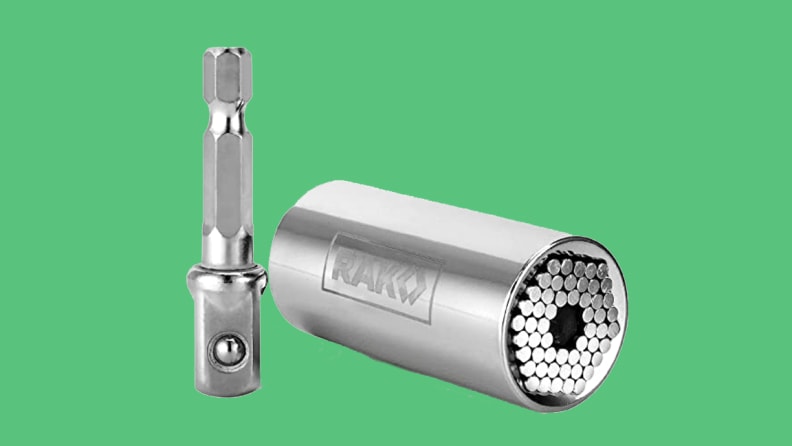 Steel socket tool on green background