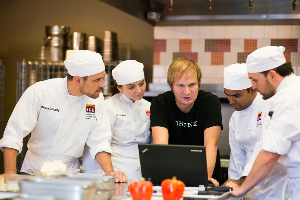 Chefs at the Institute of Culinary Education working with Watson from a laptop