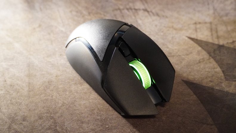 The Razer Basilisk V3 X HyperSpeed in the color black, with a green light on the scroll wheel. It cost around $70.