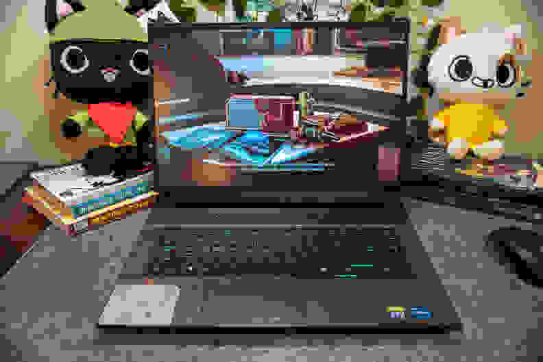 A powered-on laptop showing a colorful scene from a videogame.