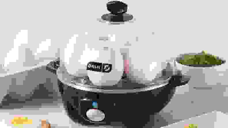 A Dash rapid egg cooker making a half dozen boiled eggs.