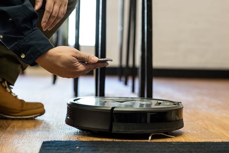 A robot vacuum runs the obstacle course.