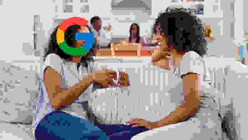 Two women talking but one of their heads is the Google logo