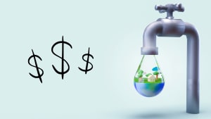 A water faucet dripping a large drop filled with a home