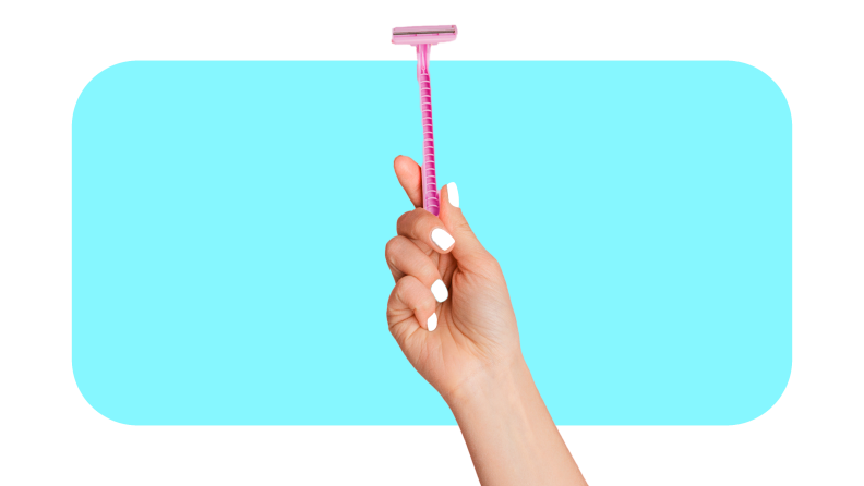 Person holding up pink razor in hand.