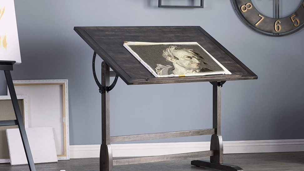 Photo of a dark brown wooden drafting table.