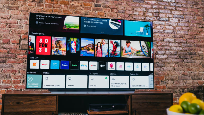 The LG C1 OLED TV displaying the webOS smart platform home screen in a living room setting