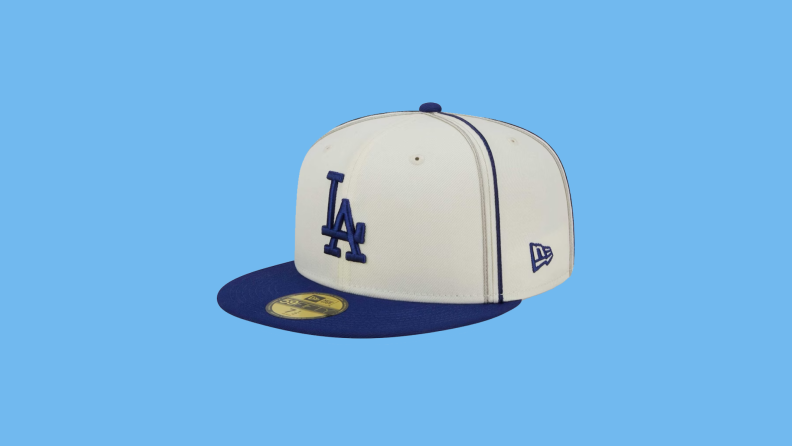 A Los Angeles Dodgers hat on a blue background.