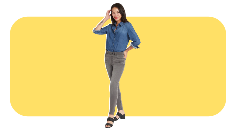 Model wearing gray denim jeans and blue denim button-down shirt.