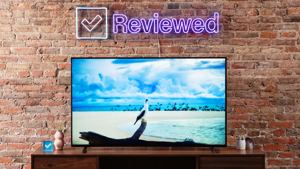 The Sony X90K LED TV features a picture of a bird sitting on a branch and surrounded by water on the screen.