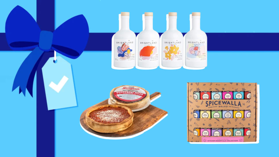 White bottles, a pizza pack and a spice box on a blue gift background