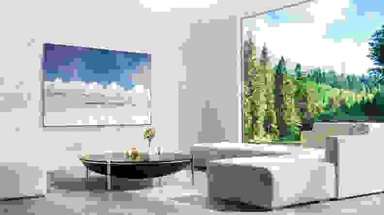 The LG G2 Gallery OLED displayed on the wall of an upscale living room
