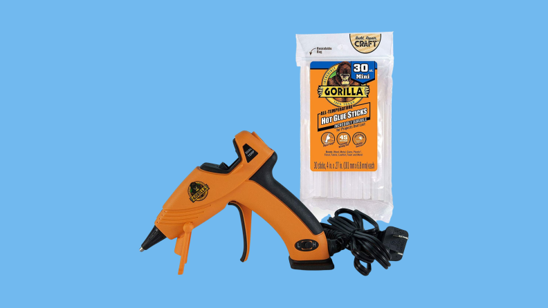 Product image of the Gorilla Glue Gun on a Reviewed background.
