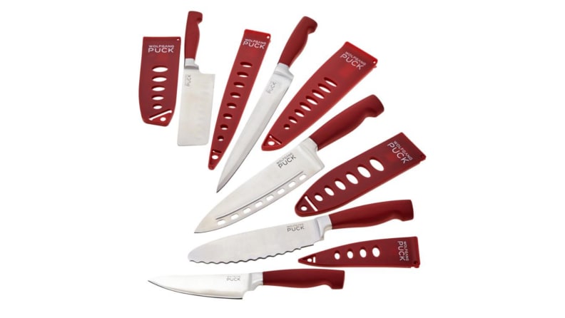 An image of a set of knives, featuring the knives splayed out in descending order from smallest to largest alongside their knife cases.