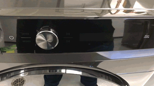 A gif showing a hand messing with the washer's settings.
