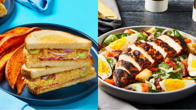 A sandwich with potato wedges on the left. A salad with hard boiled eggs and grilled chicken on the right.