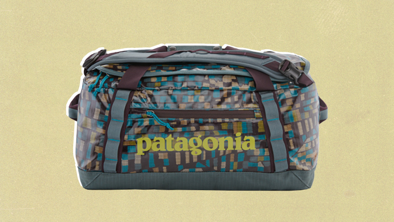 A Patagonia duffel bag with a multicolored print of gray, blue, and tan.